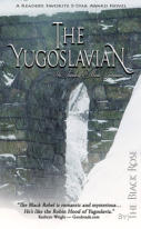 stone bridge with arched passage surrounded by snow
